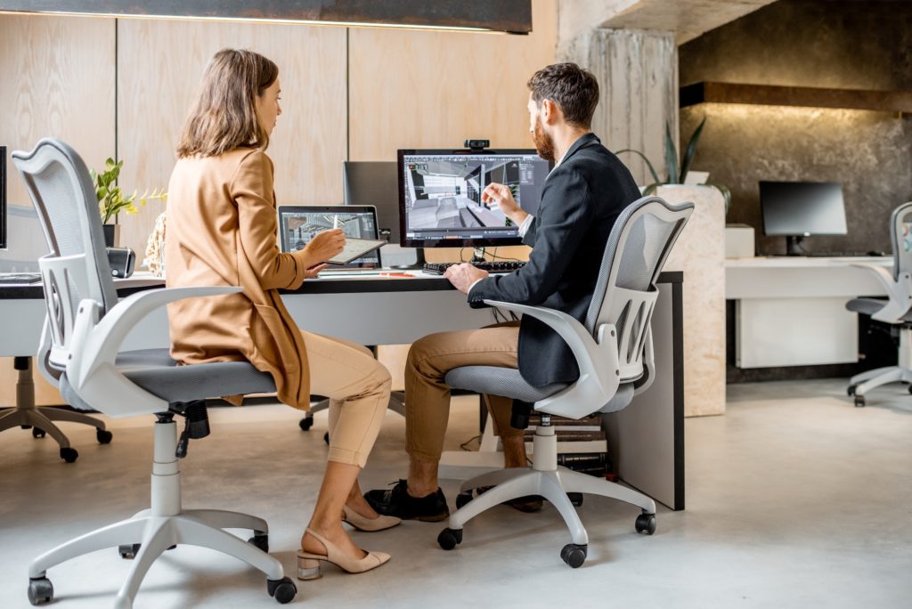 Two interior designers working in the office